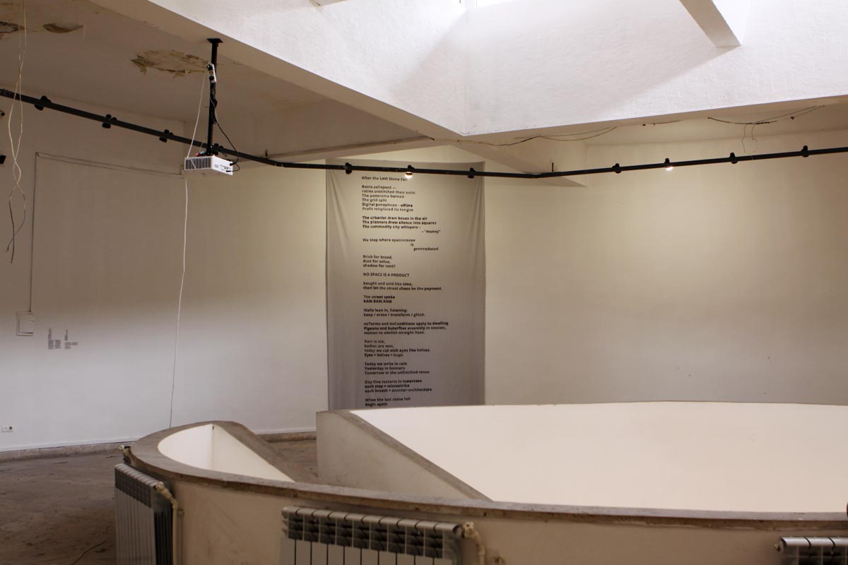 banner on the wall witha a text on it inn the exhibition space